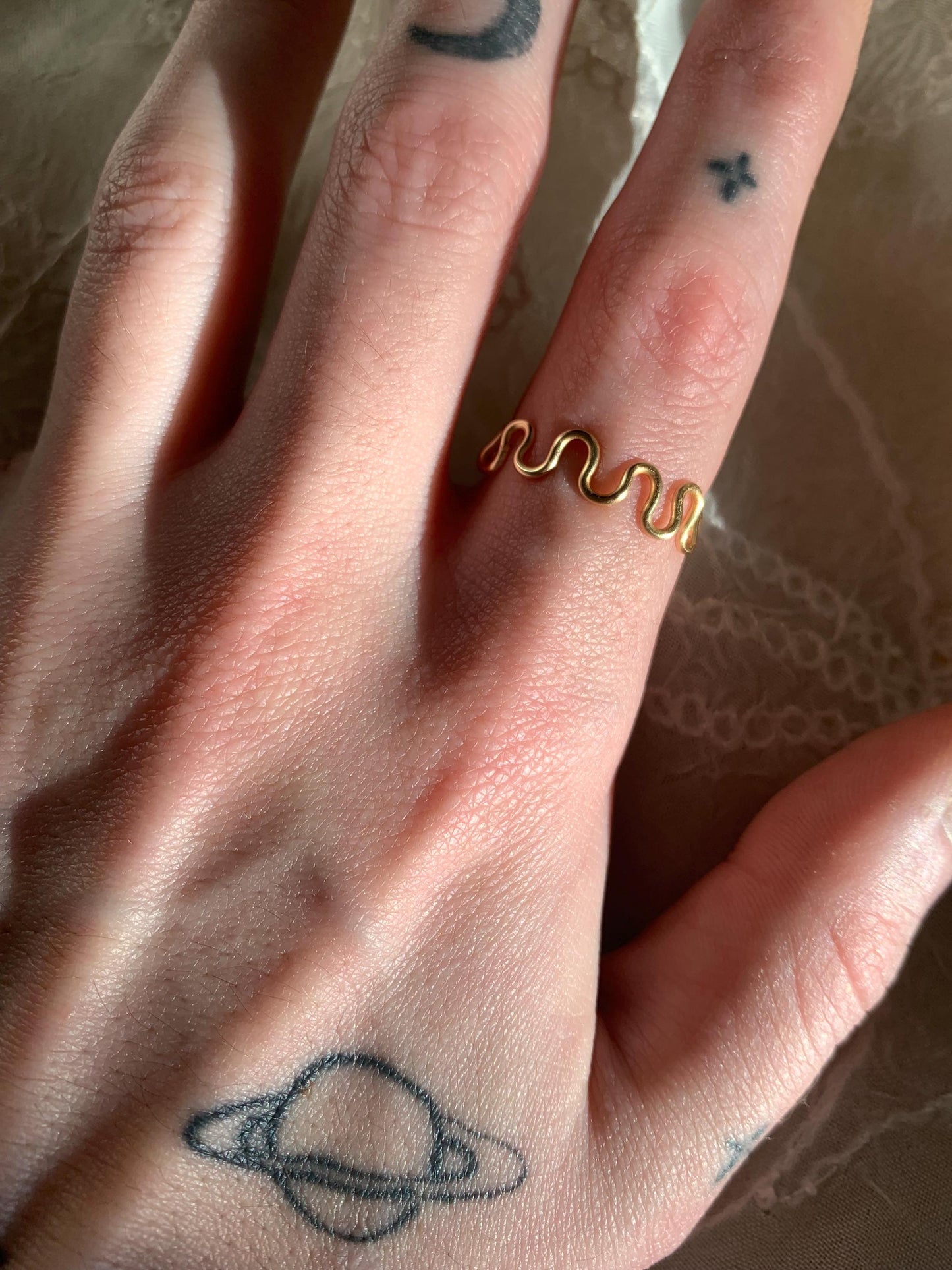 Gold squiggly and swirly set adjustable rings