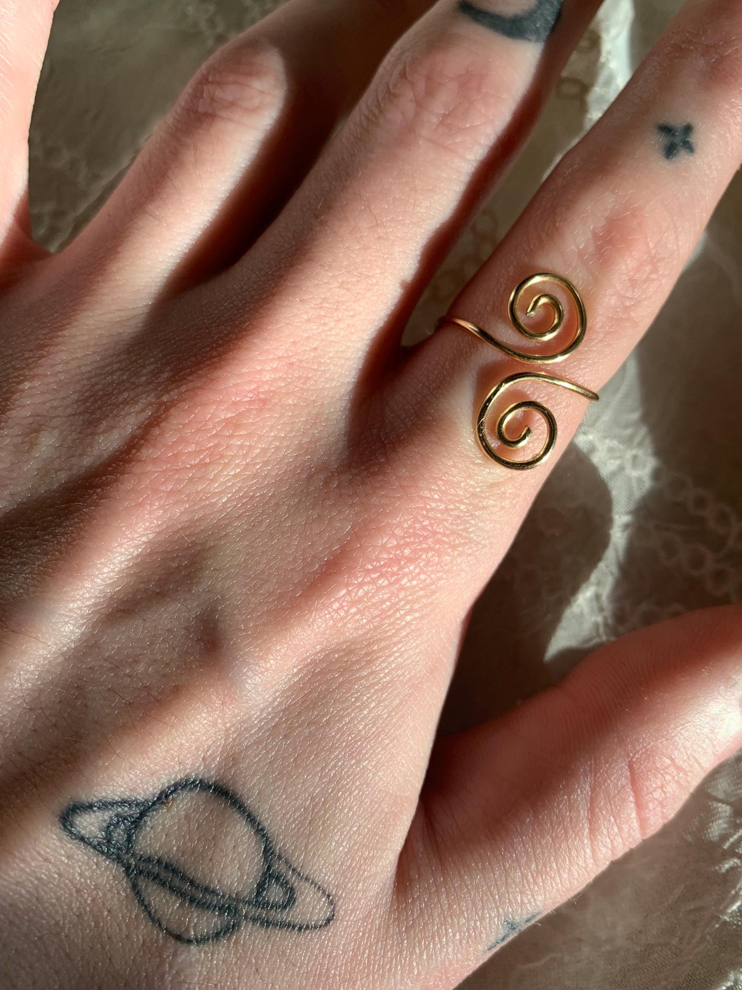 Gold squiggly and swirly set adjustable rings