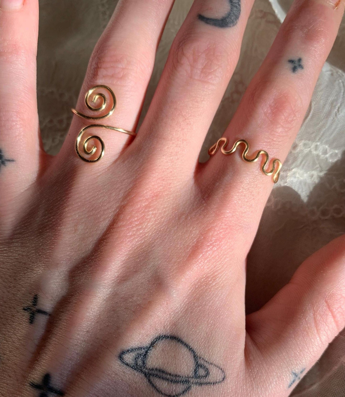 Gold squiggly and swirly set adjustable rings